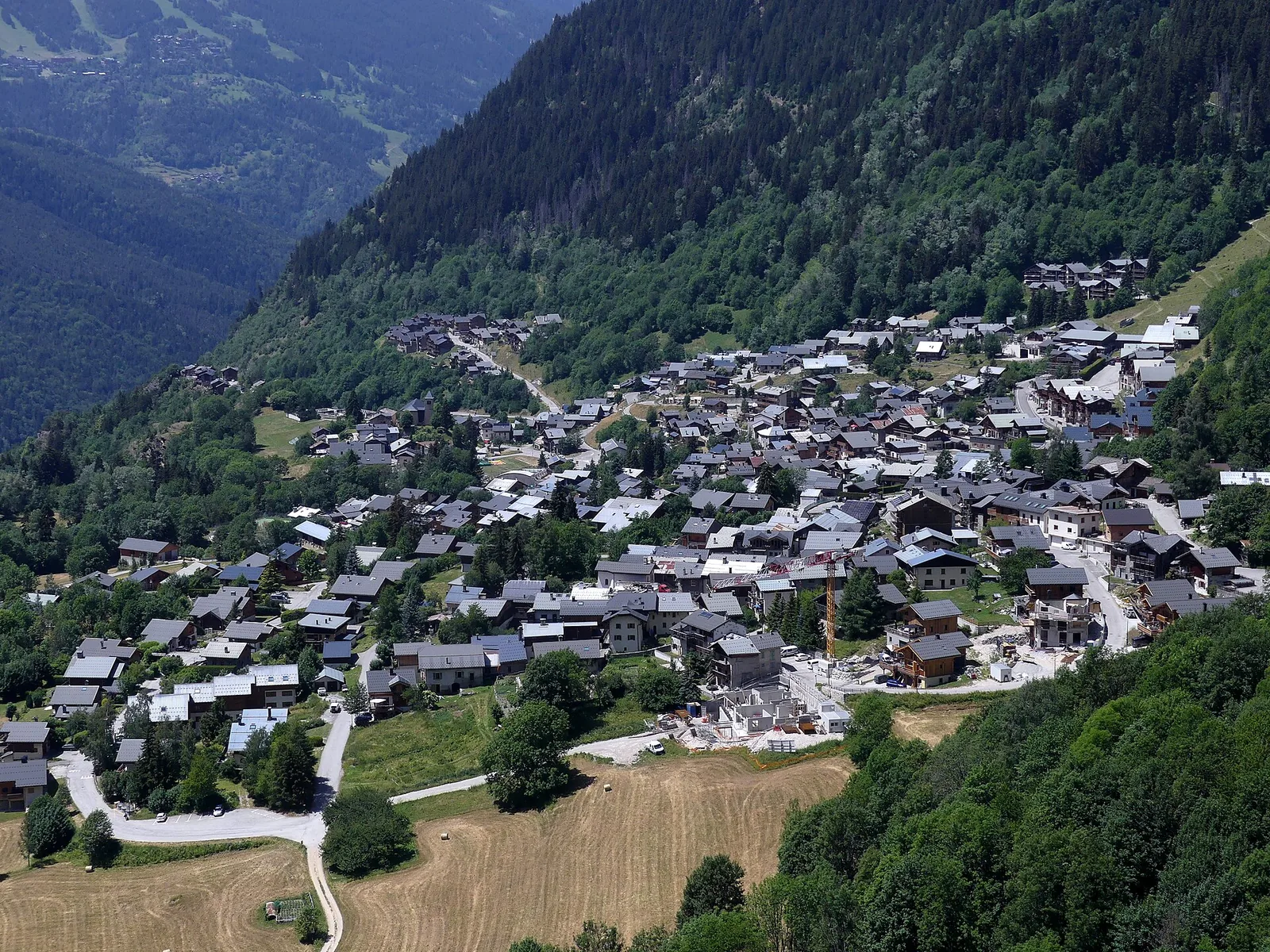 Champagny-en-Vanoise chef-lieu clustered on the hillside in early summer